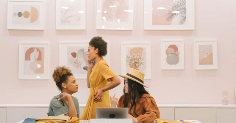 Fashion Designers - People Sitting on Chair in Front of Table