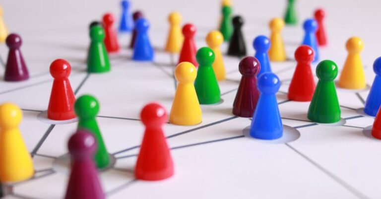 Networking - Close Up Photography of Yellow Green Red and Brown Plastic Cones on White Lined Surface