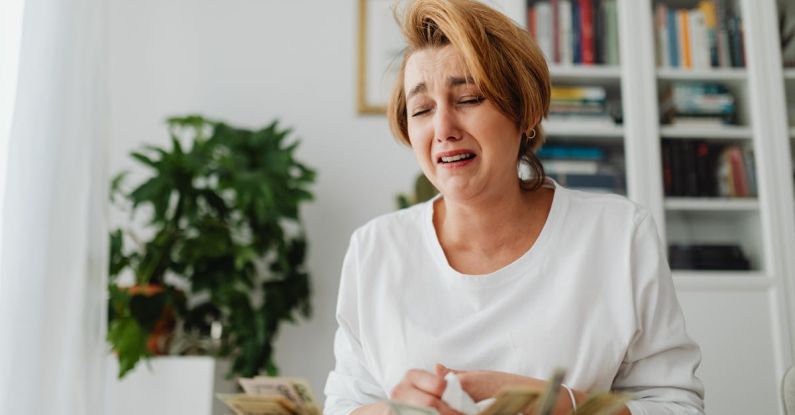 Inflation Rates - Woman Counting Money and Crying 