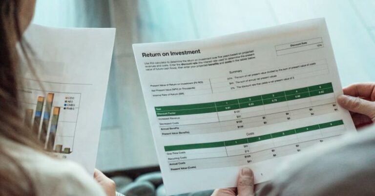 Investment Portfolios - A Person Holding a Paper