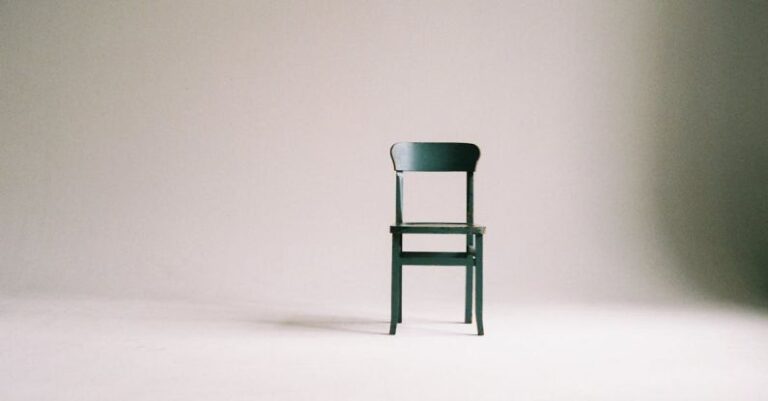 Minimalism - Wooden Chair on a White Wall Studio