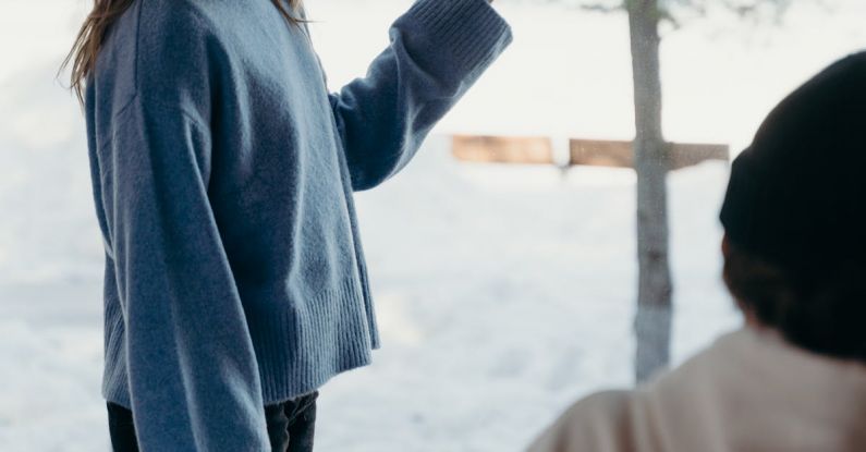 Digital Detox - Man Looking at Girlfriend Standing by Window in Hotel Room