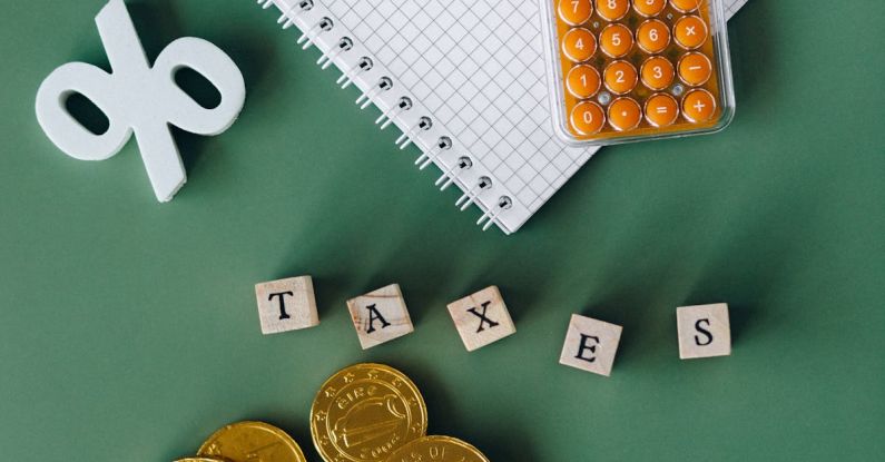 Tax Refund - Notebook and Calculator on Green Surface