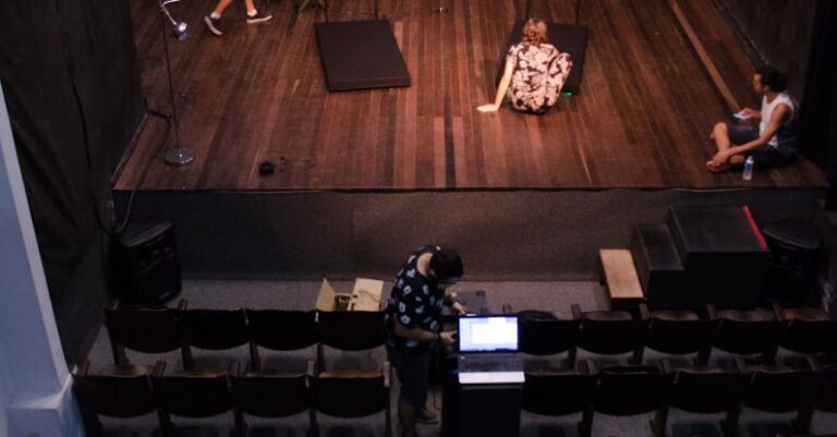 Actors - Man Standing on Stage